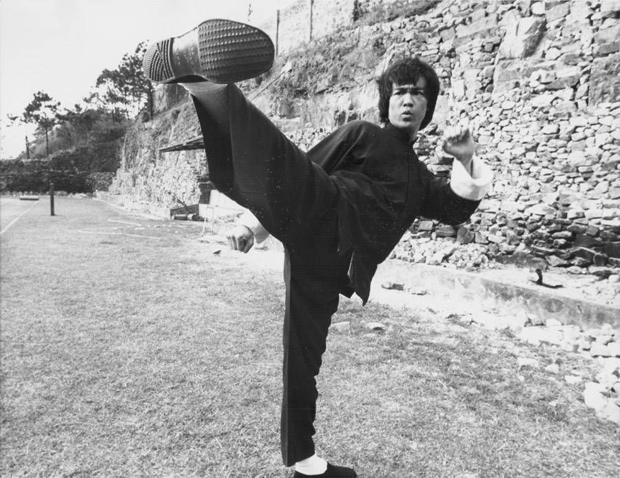 Bruce Lee kicking pose.