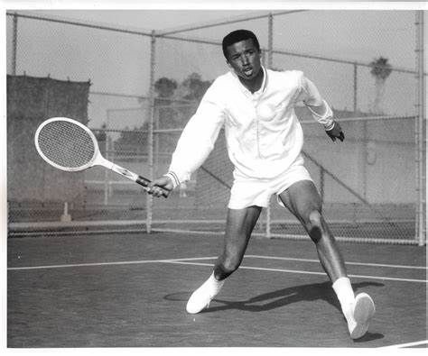 Arthur Ashe playing tennis.